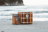 Wooden hot tub on a snowy beach with a blurred background sulis hot tub